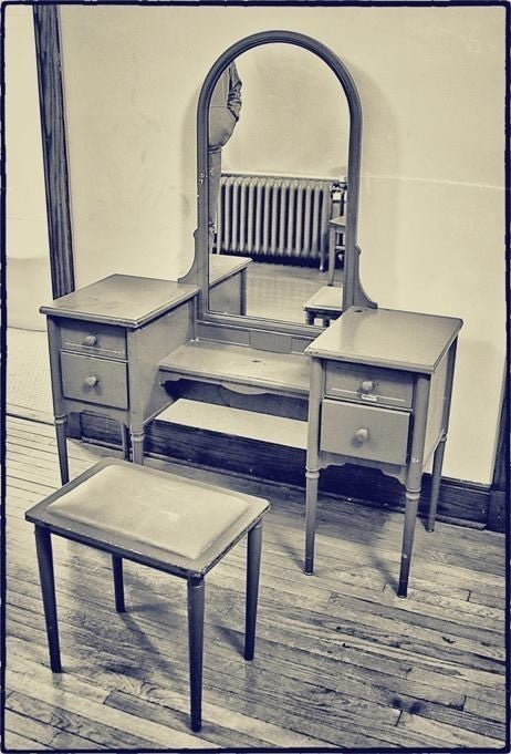 original c. 1930's completely refinished pressed and folded turned and tapered brushed steel "simmons" vanity with original tilting arch top mirror