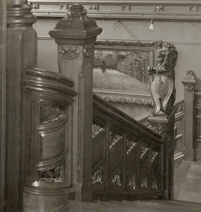 original and unrestored 19th century antique american interior residential potter palmer mansion partial intact staircase section with elaborate carving and iron work