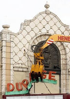 historically important late 1920's american exterior black glazed terra cotta figural dupage theater  facade "comedy" head or mask fragment with flowing hair