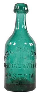 early to mid-1850's privy dug emerald green iron pontiled squat body soda bottle with high shoulders and a tapering neck with applied blob top.