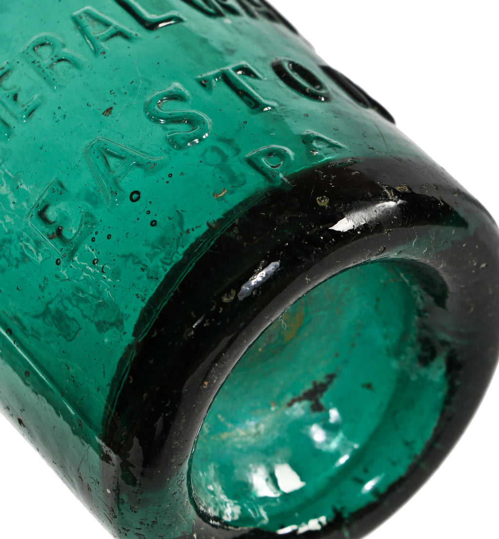 early to mid-1850's privy dug emerald green iron pontiled squat body soda bottle with high shoulders and a tapering neck with applied blob top.