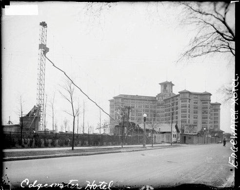 distinctive early 1920's single-sided ornamental wrought iron edgewater hotel "information" sign with directional arrow