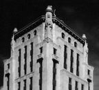 remarkable all original art deco style interior wall-mount cincinnati times-star building lobby illuminated exit light fixture with ruby red circular glass inset and bold white lettering