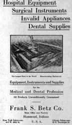 c. 1930's american medical robust all-welded joint tubular steel four-legged stationary hospital operating room trash can liner with brushed metal finish with custom tabletop