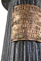 incredibly heavy duty refinished early 20th century cast iron tapered and fluted indicator floor "mich" stand with oversized wrought bronze manufacturer plaque