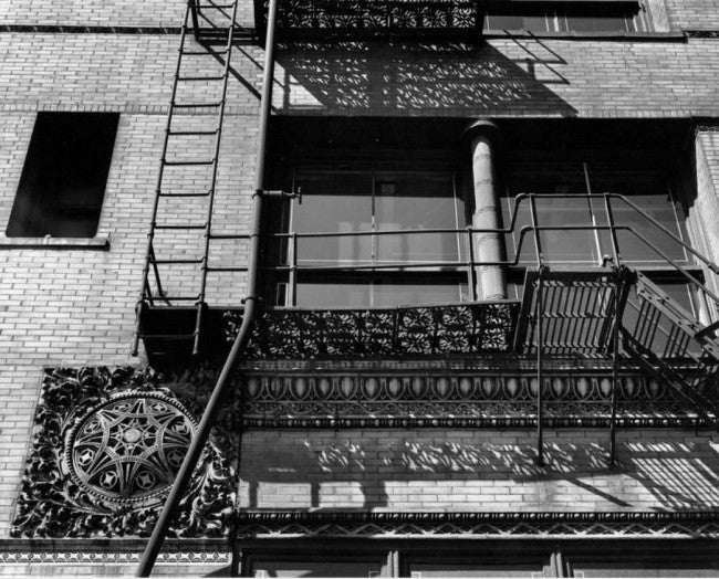 late 19th century historically important custom-cut exterior m.a. meyer loft building ornamental gothic style frank lloyd wright-designed wrought iron fire escape panel with striking moorish design