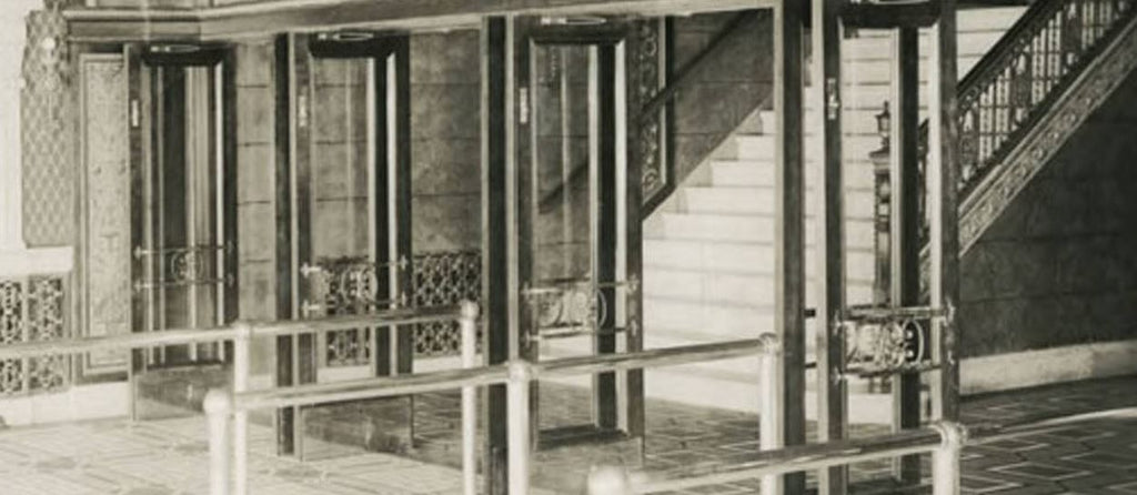 original 1929 spanish revival style ornamental wrought iron capitol theater building entrance door push bar