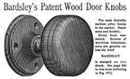 two matching original late 19th century varnished solid oak wood ball-shaped interior residential passage door handles with brass shanks