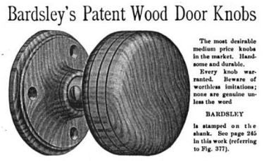 two matching original late 19th century varnished solid oak wood ball-shaped interior residential passage door handles with brass shanks