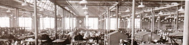 group of four matching well-maintained vibrant green porcelain enameled c. 1930's american industrial factory single electric pendant lights comprised of cold-rolled steel