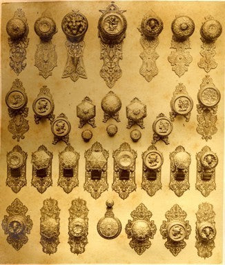 finely cast c. 1870's antique american ornamental cast bronze banded rim doorknob containing a sunken center with grapes and leafage