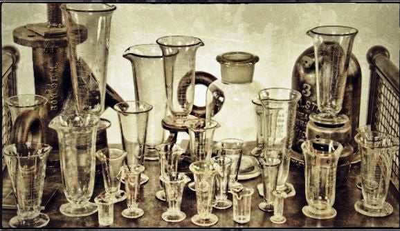 19th century diminutive nicely aged cast and/or wrought yellow brass mortar and matching pestle with with intact opposed lugs