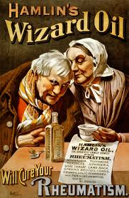 original and intact privy dug crude blue aqua early oval wizard oil patent medicine bottle manufactured for john a. and lysander b. hamlin in chicago il.