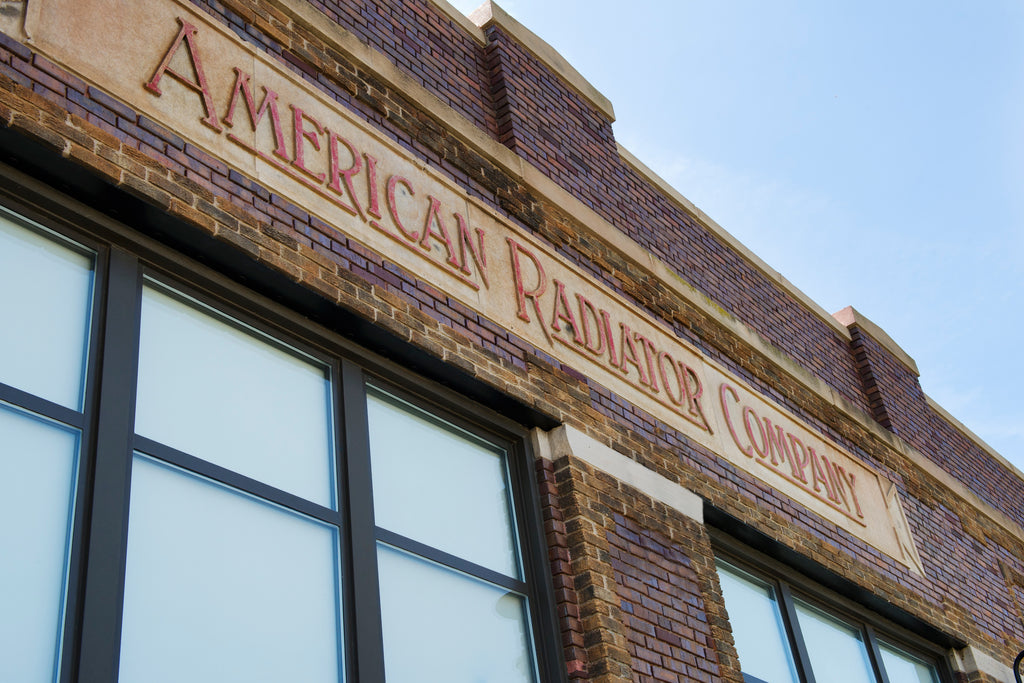 early 20th century original single-sided cast iron "american radiator company" commercial building basement boiler name plaque with opposed mounting holes