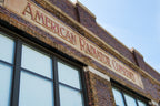 early 20th century original single-sided cast iron "american radiator company" commercial building basement boiler name plaque with opposed mounting holes