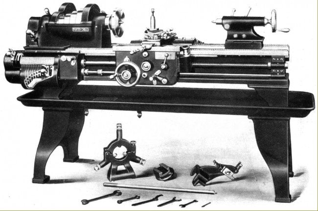 two original early 20th century antique american industrial matching heavy duty cast iron factory lathe machine bases with a brushed and lacquered finish throughout