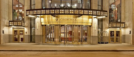 very rare all original c. 1920's american ornamented double-sided cast bronze medinah athletic club exterior entrance door grille with starburst motif shield