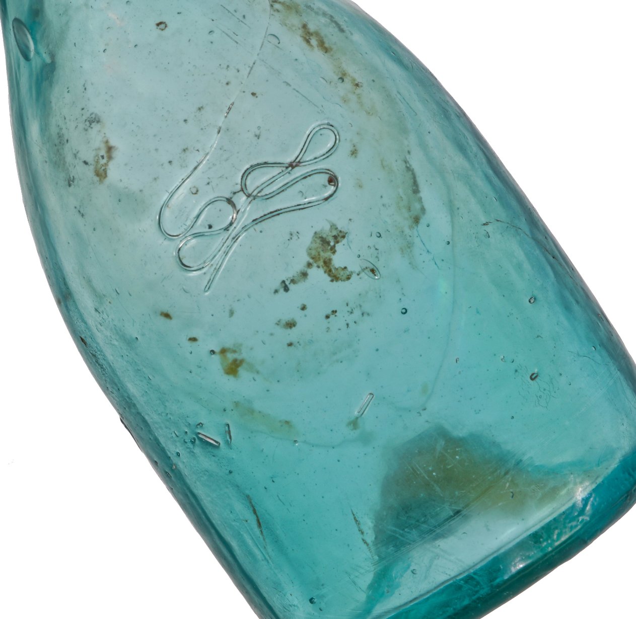 very crudely made late 1840's or 1850's original privy-dug aqua blue soda bottle with applied tapered collar manufactured for j cairns, in st. louis, mo.
