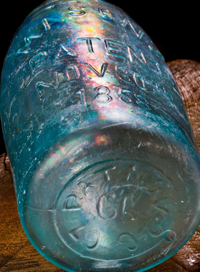 original antique dug blue aqua 'midget' mason jar manufactured by the hero fruit jar company.