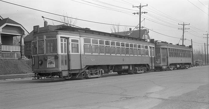 hard to find early 20th century milwaukee streetcar wall-mount drop-down diminutive passenger stool with solid maple wood seat and fully functional spring-loaded cast iron mounting bracket