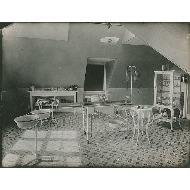 c. 1915 original fanciful cast iron and cold-rolled heavy gauge steel mobile hospital operating room fully enclosed storage cabinet with brushed metal finish