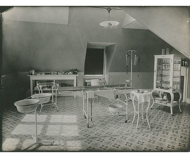 refinished 1930's american antique medical cold-rolled steel stationary hospital room supply table with intact solid white vitrolite glass shelves