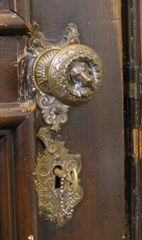 early 1870's original and highly collectible "doggie" figural doorknob with matching oversized escutcheon mounted on a custom-built wood plaque
