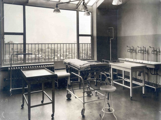 c. 1920's all original and intact fully adjustable pressed and folded steel cook county hospital operating room examination room table with tubular steel legs