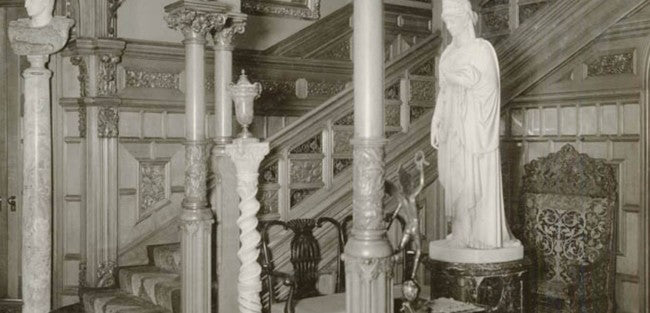 original and unrestored 19th century antique american interior residential potter palmer mansion partial intact staircase section with elaborate carving and iron work