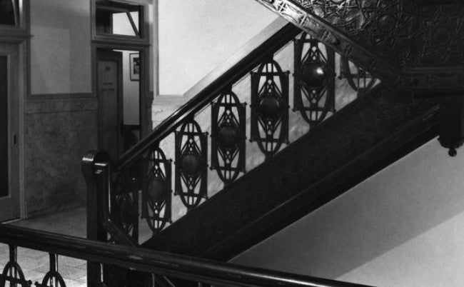 c. 1894 original and completely intact interior chicago stock exchange commercial building ornamental cast iron staircase baluster with largely intact copper-plated finish