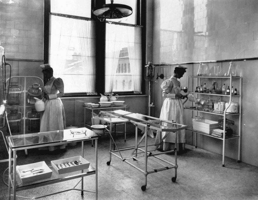 original c. 1910-20 american antique medical green painted angled steel three-tier hospital operating room workstation or stand with intact bassick swivel casters