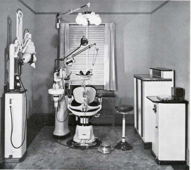 remarkable early 1920's american antique medical interior dentist's office iron and brass illuminated examination "cluster" light with white opalescent "bullet" shape glass globes