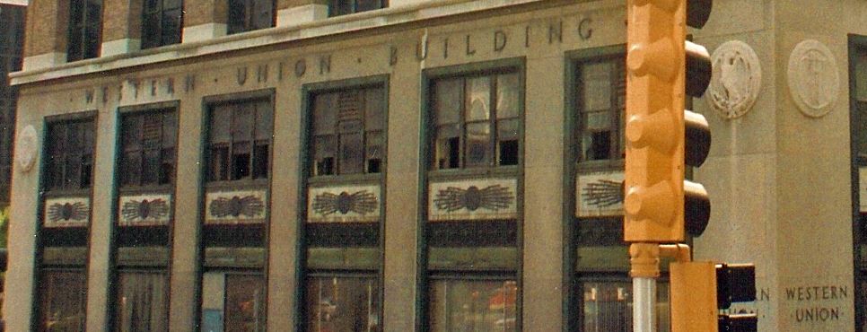 very rare c. 1920's american art deco cast bronze western telegraph company building exterior facade ornament featuring a globe flanked by lightning bolts