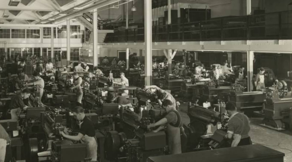 exceptional early 20th century american industrial henry ford trade school four-legged cast iron machine shop workbench or table with deck and undershelf