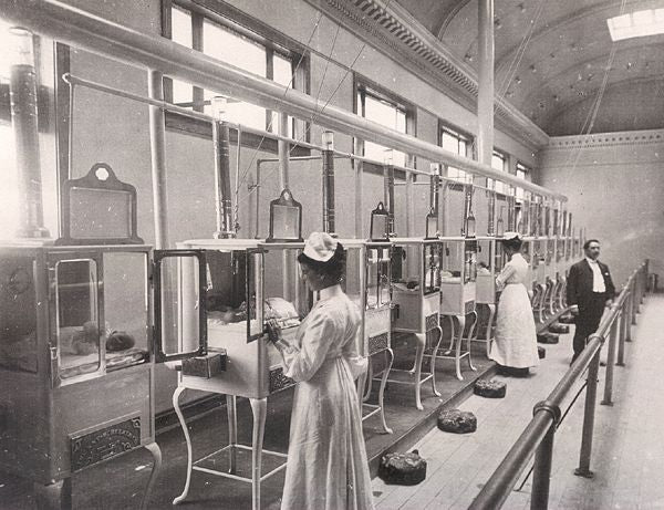 highly desirable oversized cold-rolled steel freestanding salvaged chicago antique american medical cabinet with two hinged cabinet doors, drawers, and glass sidelights