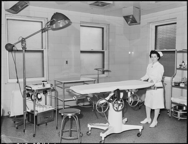 original low-lying c. 1915-20 american antique medical four-legged tubular metal stationary hospital operating room stool with solid steel rod stretchers and pressed and folded seat