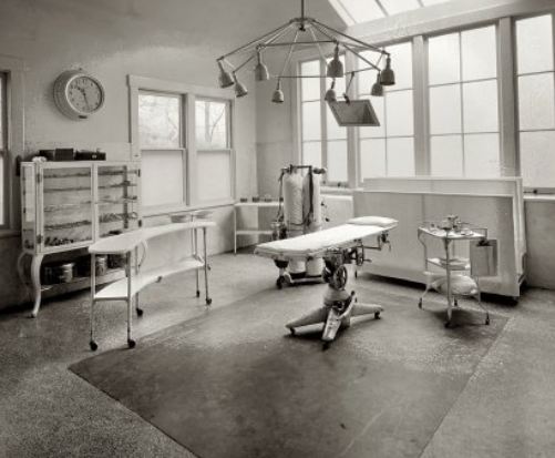 c. 1915 original fanciful cast iron and cold-rolled heavy gauge steel mobile hospital operating room fully enclosed storage cabinet with brushed metal finish
