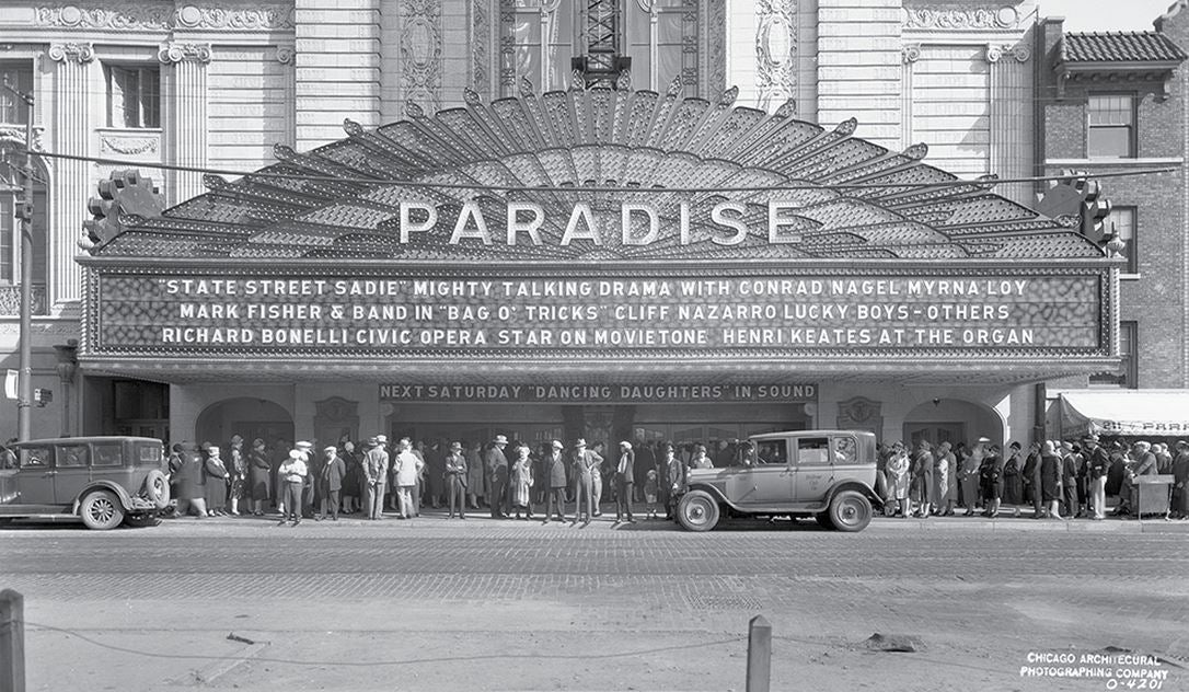 original american depression-era single-sided stamped brass paradise theater (non-extant) hub electric manufacturer plaque with black enameled background