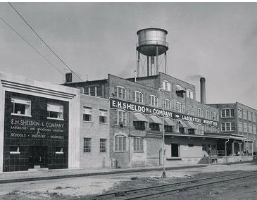 rarely found  c. 1920's vintage american industrial varnished birch wood domestic science laboratory table with original swing-out stools