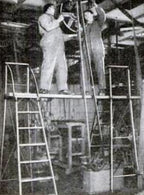 hard to find all original and fully functional "dayton" safety wood ladder with tubular rails and bassick casters