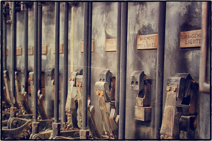 four original turn of the century american industrial beveled edge copper "equalizer" switchboard identification plaques with black enameled inlay