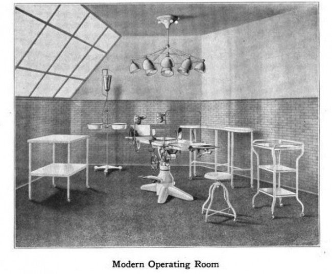 c. 1920's all original and intact fully adjustable pressed and folded steel cook county hospital operating room examination room table with tubular steel legs