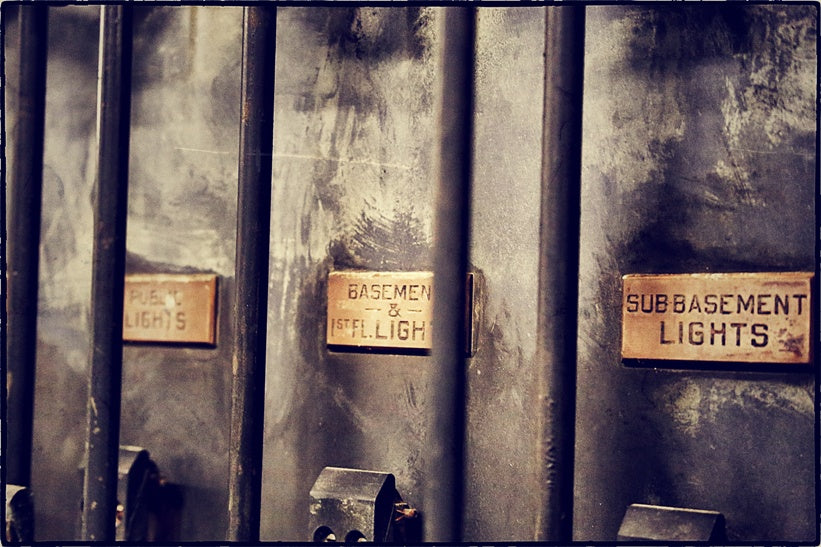 four original turn of the century american industrial beveled edge copper "equalizer" switchboard identification plaques with black enameled inlay